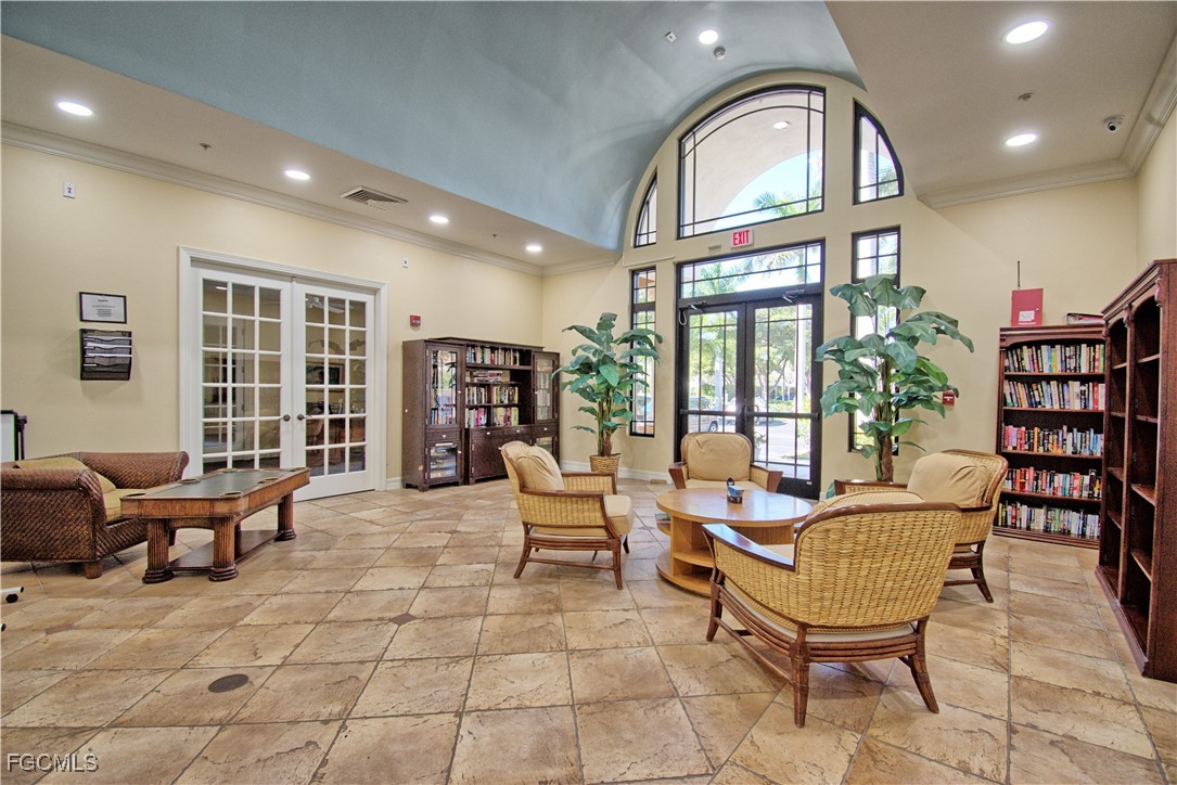 8261 Pathfinder Loop, Unit 730 Fort Myers, FL 33919 - Photo 31 of 40 a living room with furniture and a large window