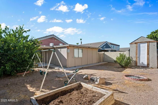a house view with a backyard space