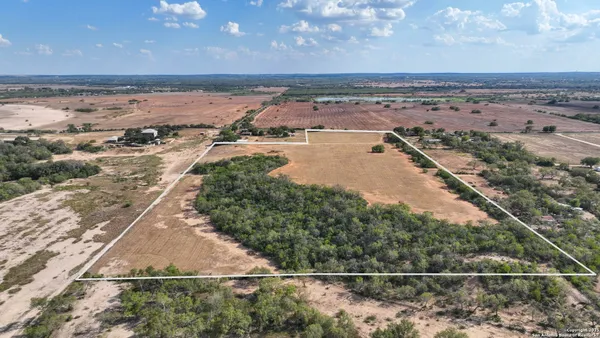 a view of a lake with a big yard