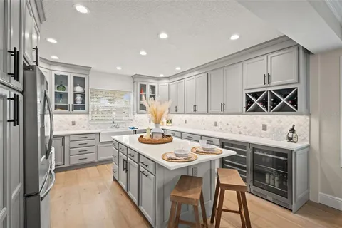 a kitchen with stainless steel appliances a refrigerator stove and microwave