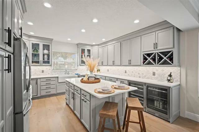 a kitchen with stainless steel appliances a refrigerator stove and microwave