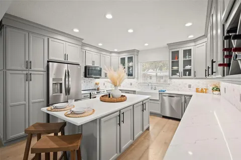 a bathroom with a sink and a window