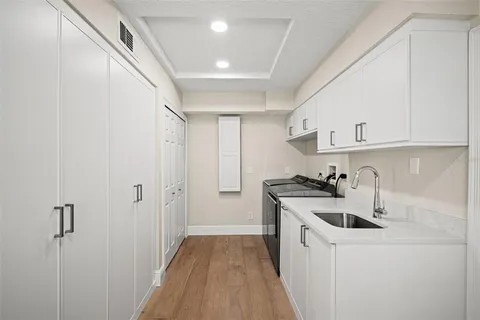a spacious bathroom with sinks mirror and a bathtub