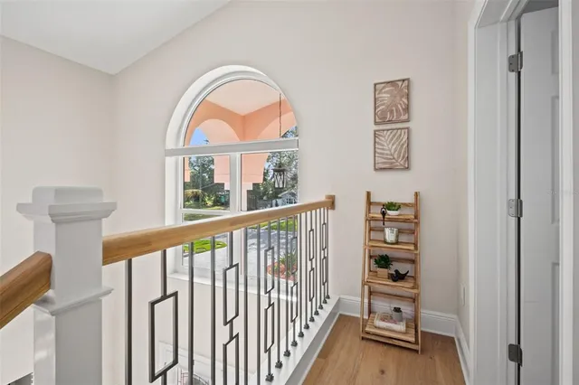 a bathroom with a bathtub and a window