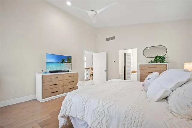a bathroom with a sink toilet a mirror and shower