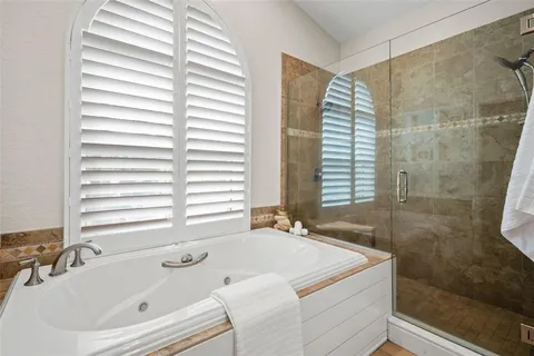 a living room with furniture and a ceiling fan