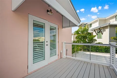 a living room with furniture and view of kitchen