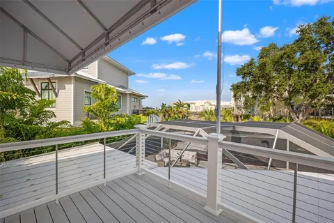 a living room with furniture a chandelier and a fireplace