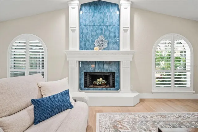 a view of swimming pool with outdoor seating and plants