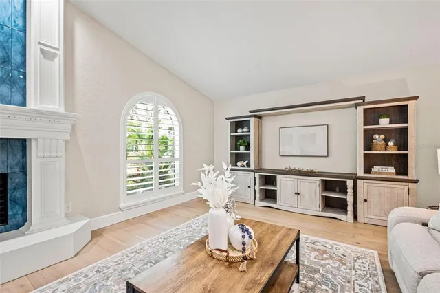 a view of a patio with chairs and potted plants