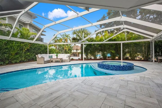 an aerial view of a house with a lake view