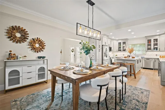 a kitchen with a stove a sink and a refrigerator