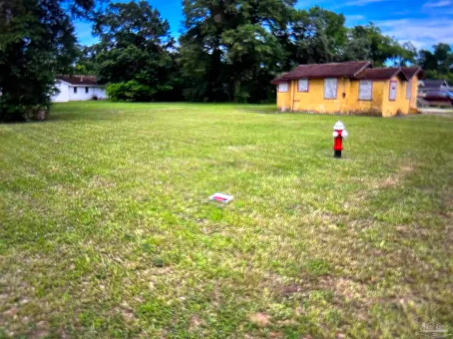a fire hydrant in the middle of a field