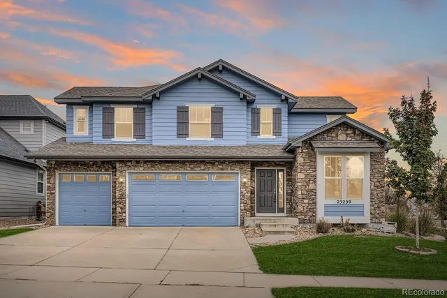 a front view of a house with yard