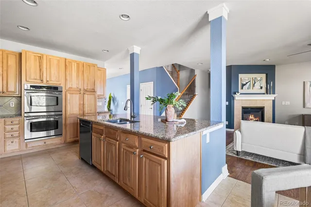 a bedroom with bed and wall painting