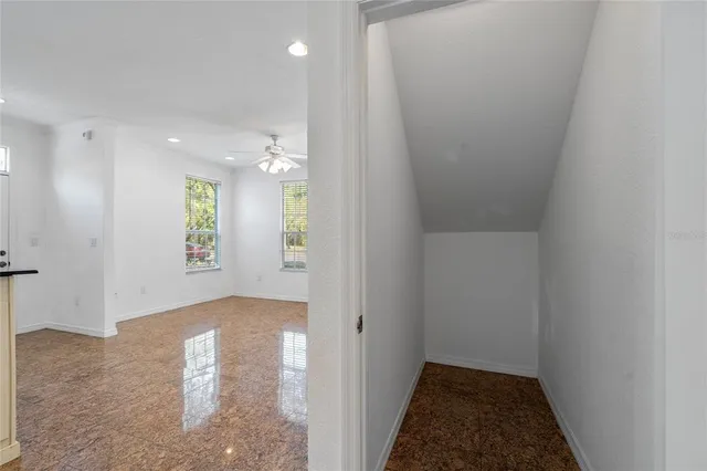 an aerial view of residential houses with outdoor space and swimming pool