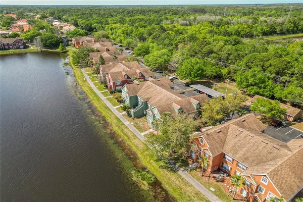 an aerial view of a house with a lake view