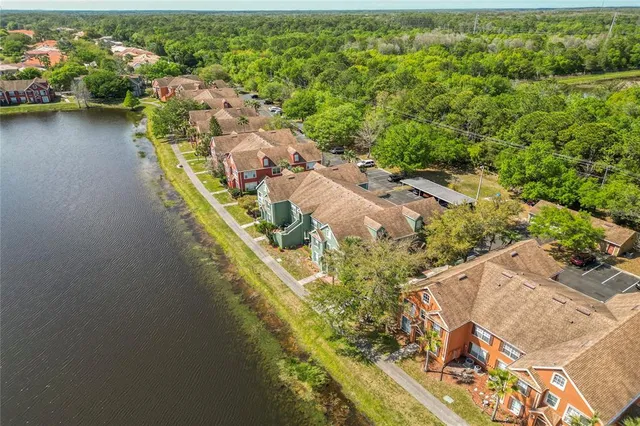 an aerial view of a house with a lake view