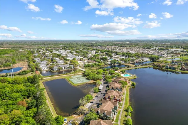 an aerial view of a city and lake view