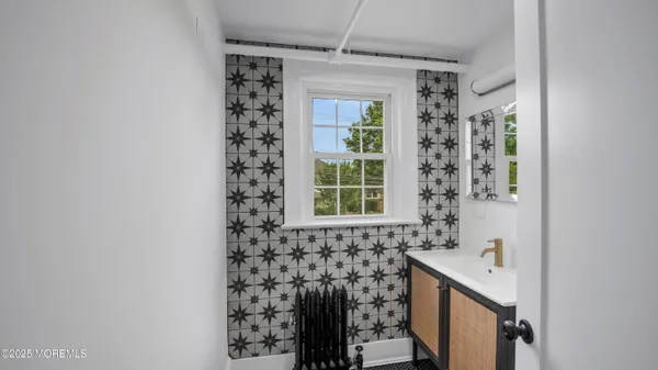 a bathroom with a sink and a shower