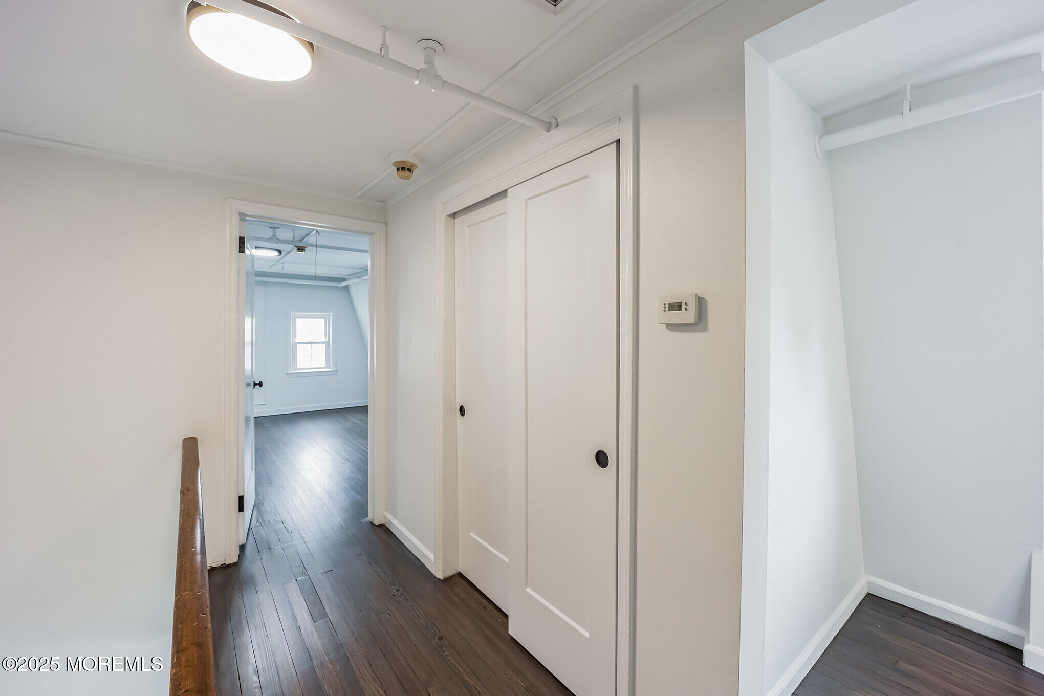 87 Maple Avenue, Unit 2 Red Bank, NJ 07701 - Photo 4 of 28 a view of a hallway with wooden floor