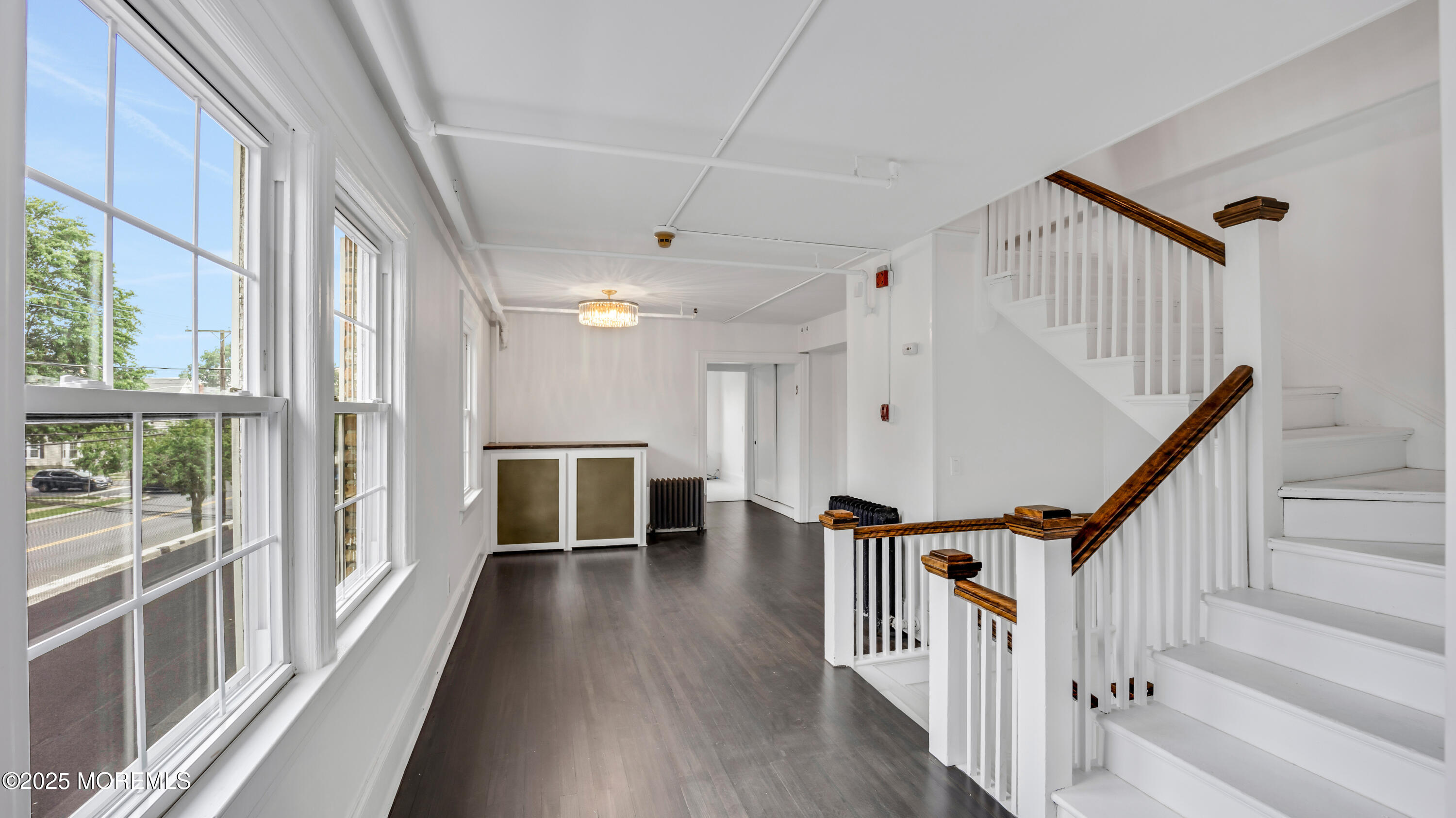 87 Maple Avenue, Unit 2 Red Bank, NJ 07701 - Photo 8 of 28 a view of an entryway with wooden floor and livingroom