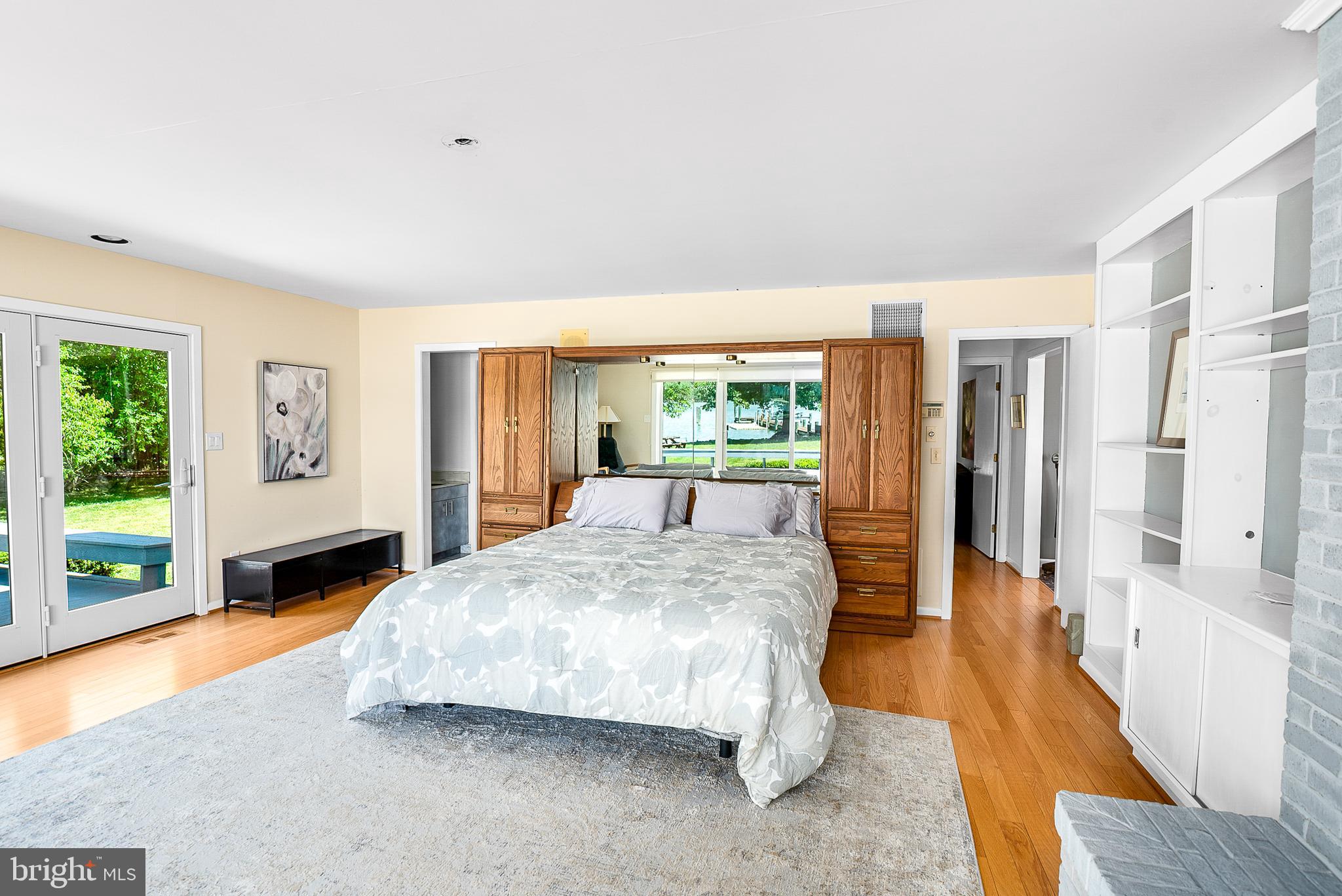 26282 Deep Water Harbor Road Easton, MD 21601 - Photo 21 of 53 a bedroom with a large bed and a large window