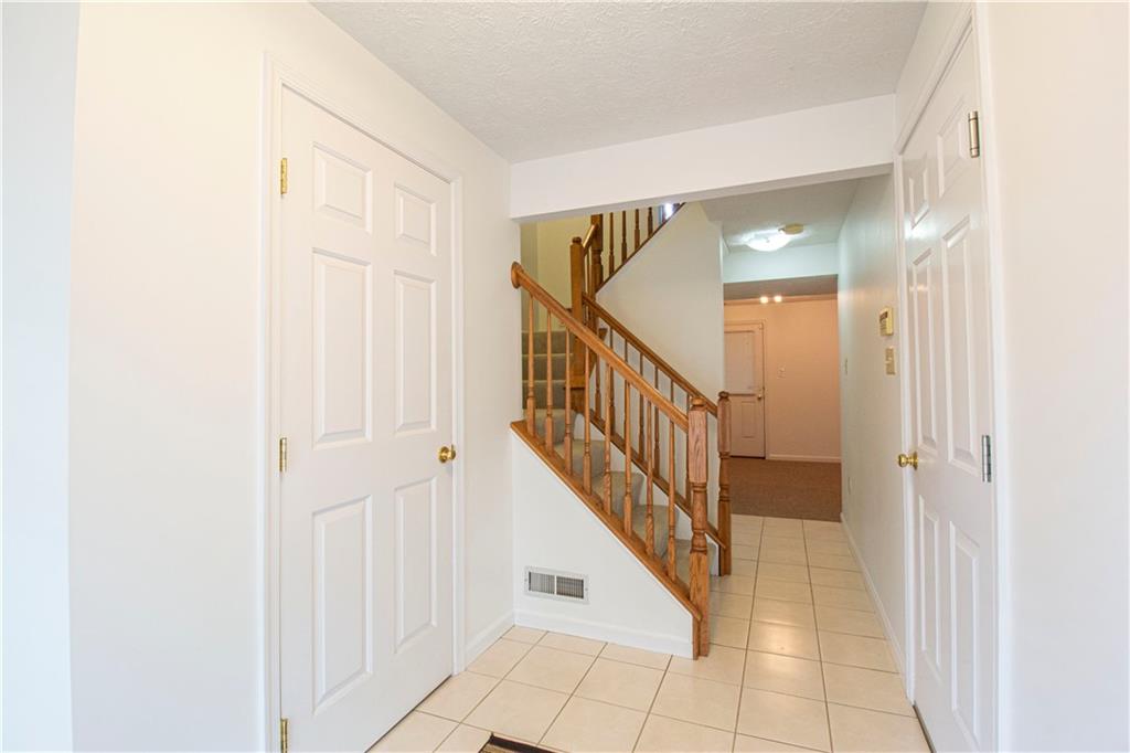 5 Hemingway Street Pittsburgh, PA 15213 - Photo 4 of 25 Entry with powder room, garage access, and large lower level room with access to back