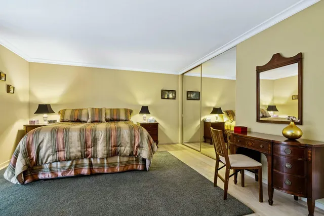 a patio with plants and chairs