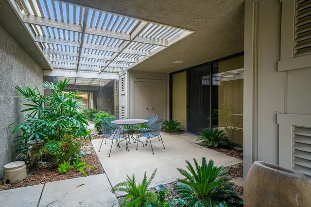 a spacious bathroom with a sink mirror and vanity