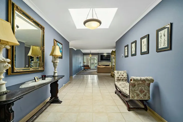 a living room with furniture and a mirror