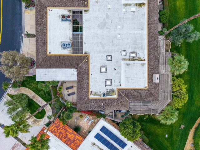 a view of a pathway both side of house