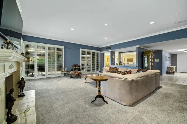 a living room with fireplace furniture and a flat screen tv