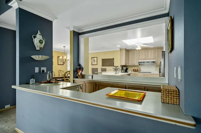 a view of a living room and kitchen