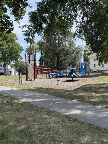 a view of dirt field with trees