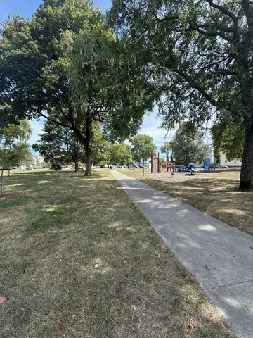 a picture of a bench in front of a window