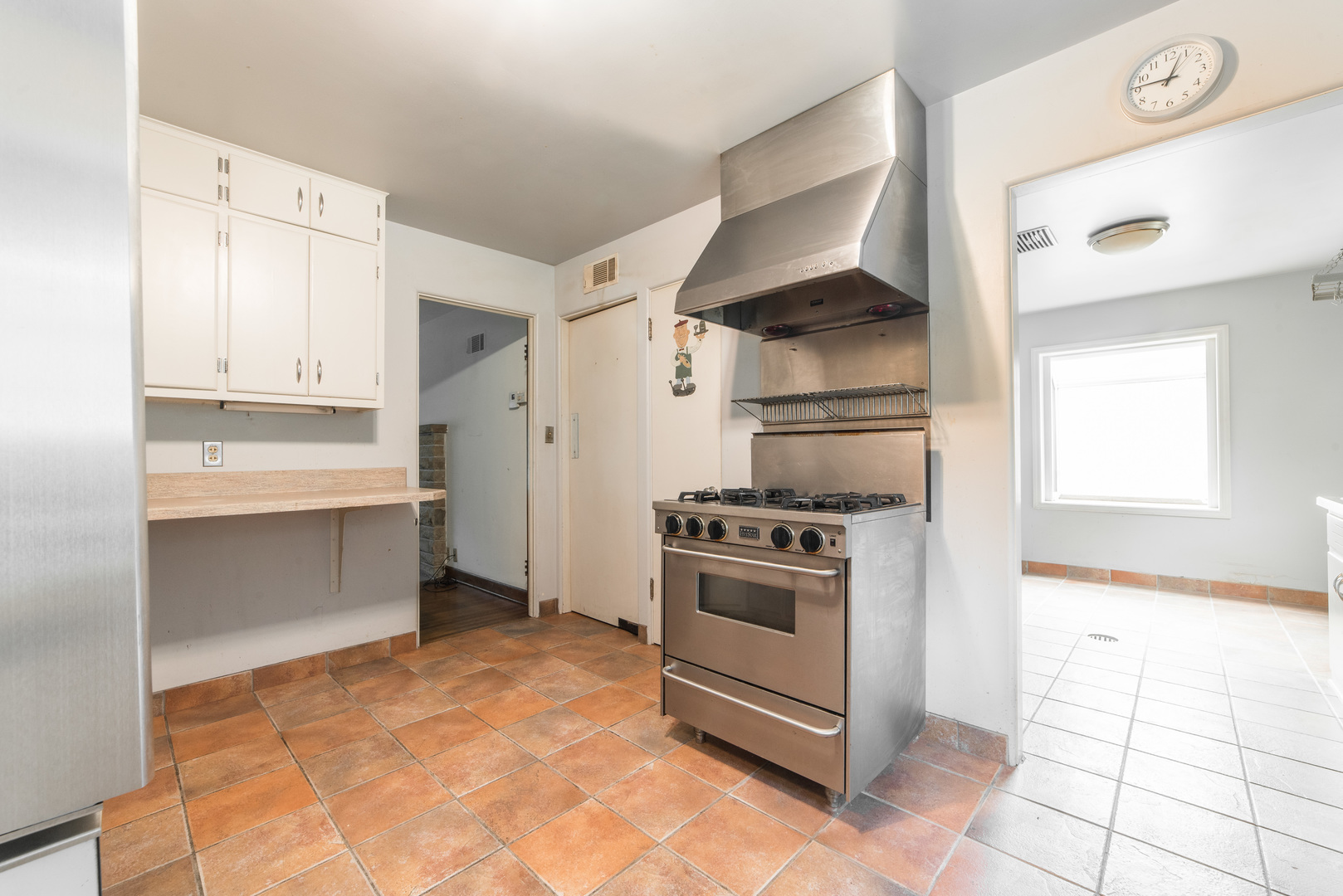 591 Normal Road DeKalb, IL 60115 - Photo 11 of 24 a kitchen with white cabinets and appliances