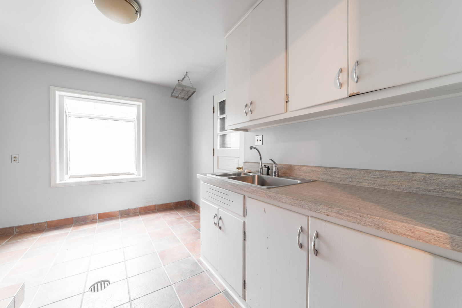 591 Normal Road DeKalb, IL 60115 - Photo 12 of 24 a kitchen with appliances cabinets and a window