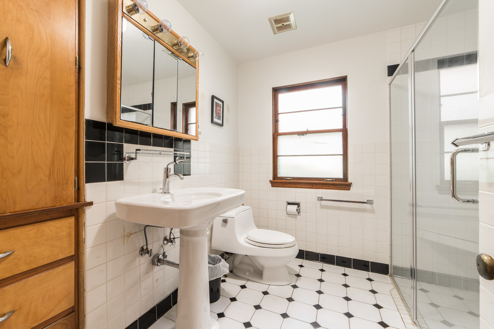 591 Normal Road DeKalb, IL 60115 - Photo 16 of 24 a bathroom with a sink toilet a mirror and shower