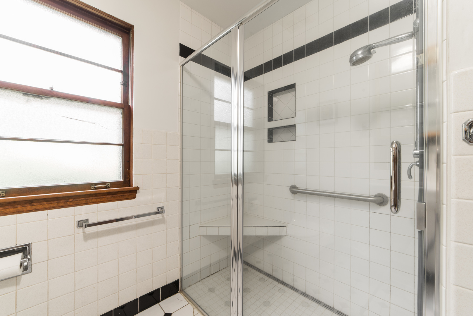 591 Normal Road DeKalb, IL 60115 - Photo 17 of 24 a bathroom with a shower and a window