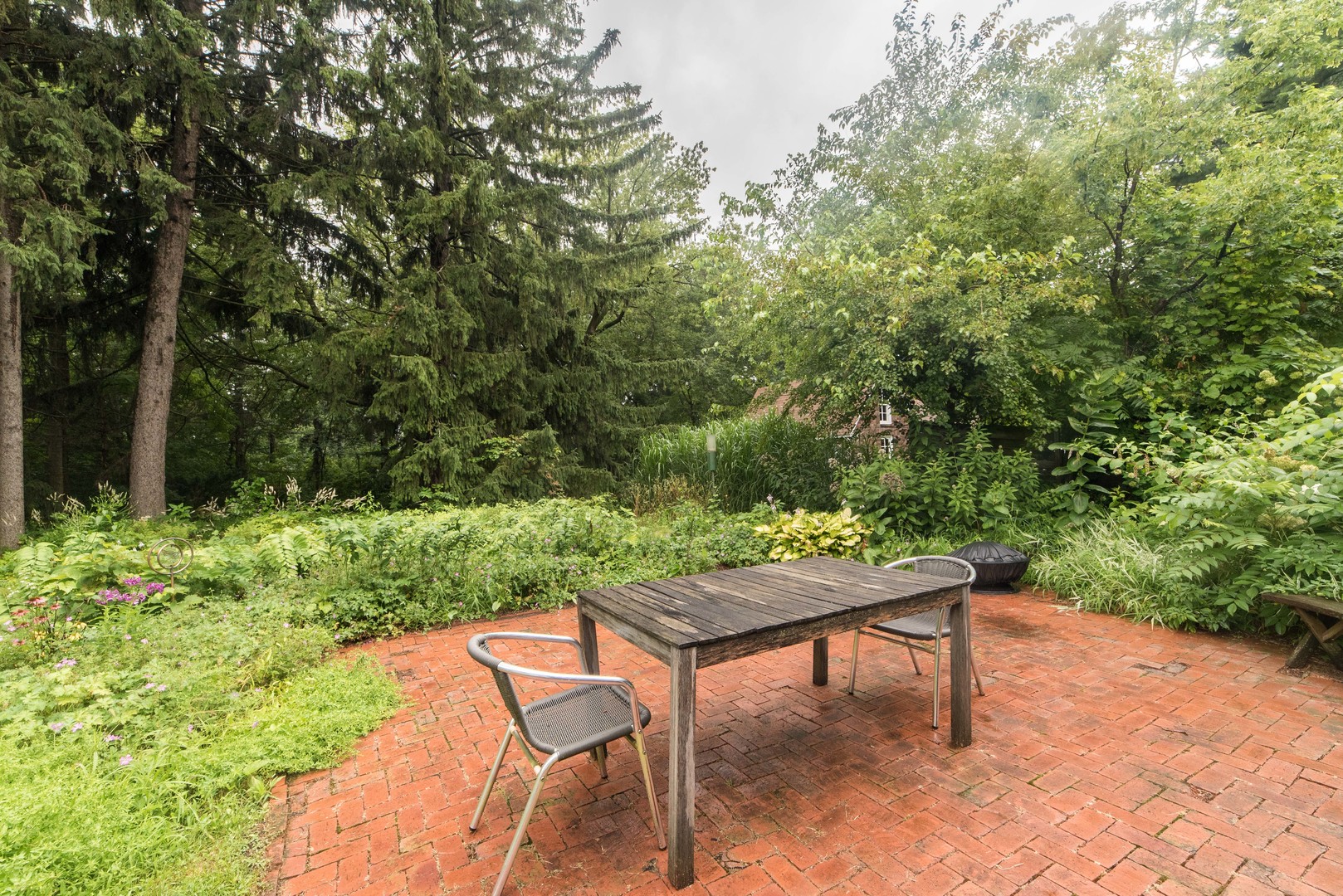 591 Normal Road DeKalb, IL 60115 - Photo 19 of 24 a backyard of a house with table and chairs