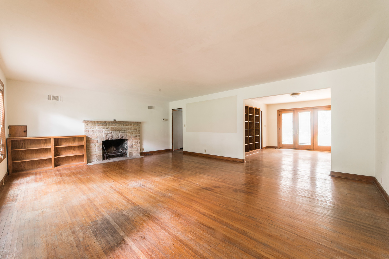 591 Normal Road DeKalb, IL 60115 - Photo 3 of 24 a view of empty room with fireplace and wooden floor