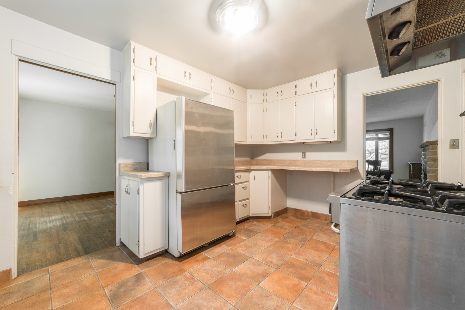 591 Normal Road DeKalb, IL 60115 - Photo 10 of 24 a kitchen with a refrigerator sink and cabinets