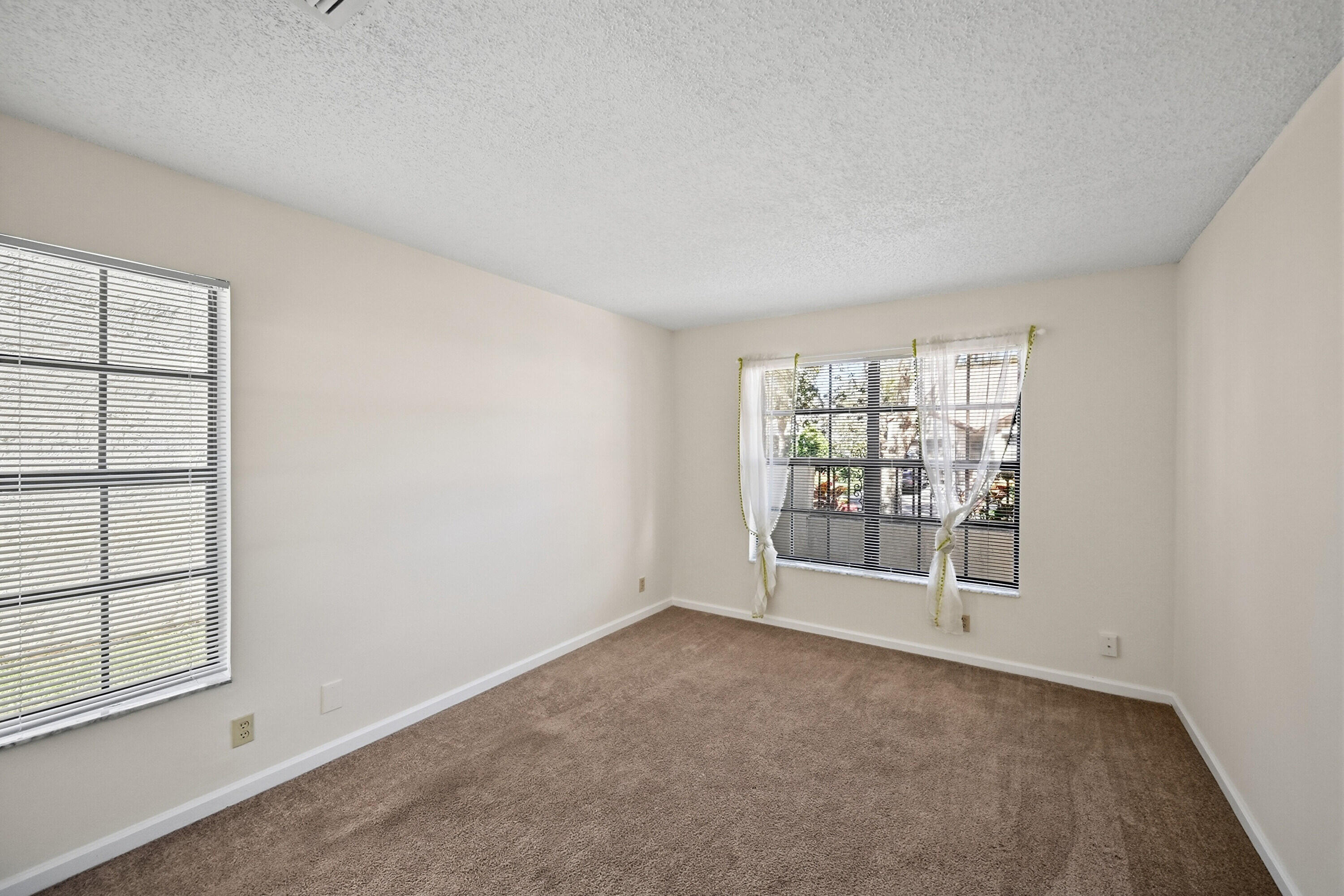 440 Ashwood Place Boca Raton, FL 33431 - Photo 14 of 32 an empty room with windows