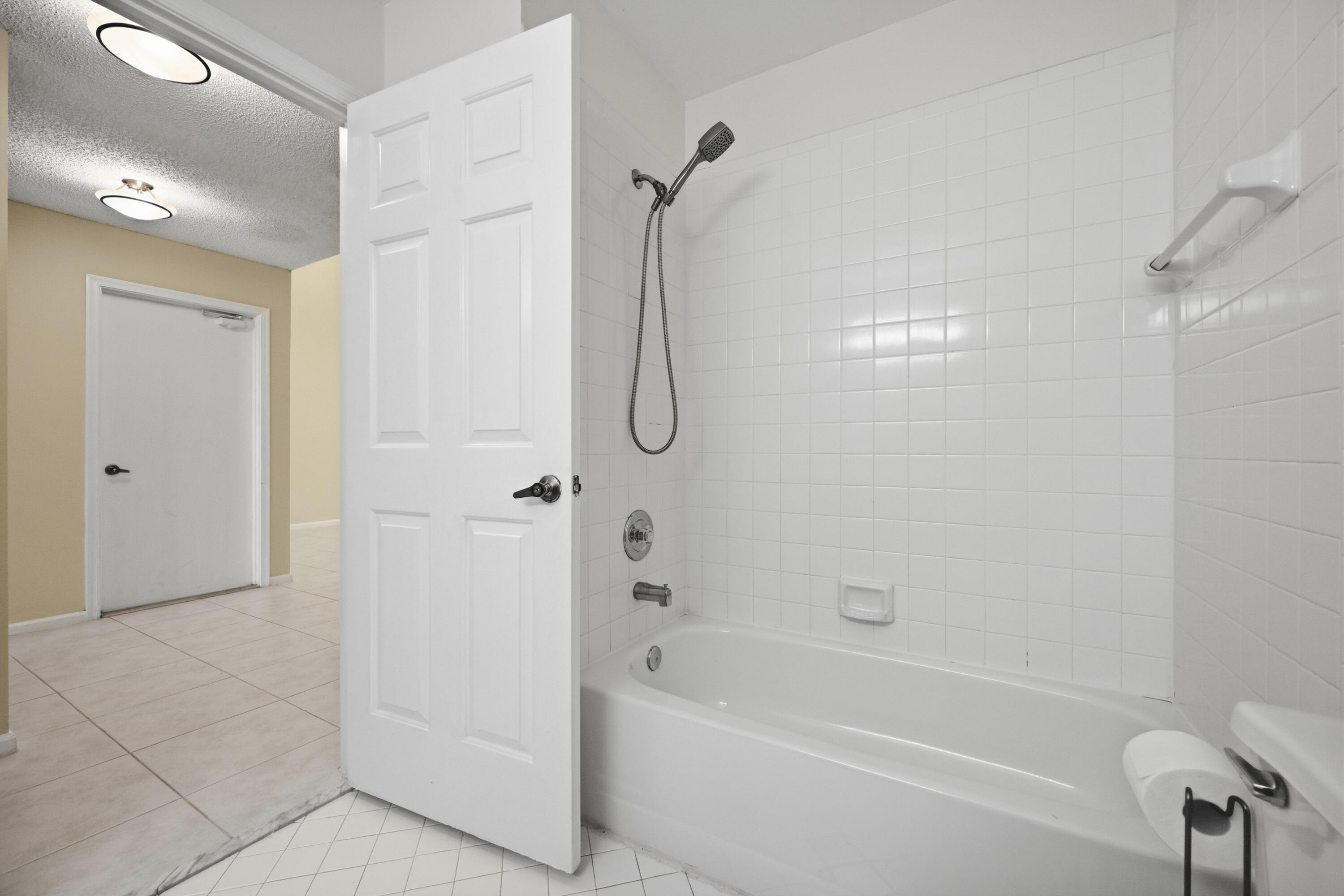 440 Ashwood Place Boca Raton, FL 33431 - Photo 17 of 32 a bathroom with a bath tub with a shower