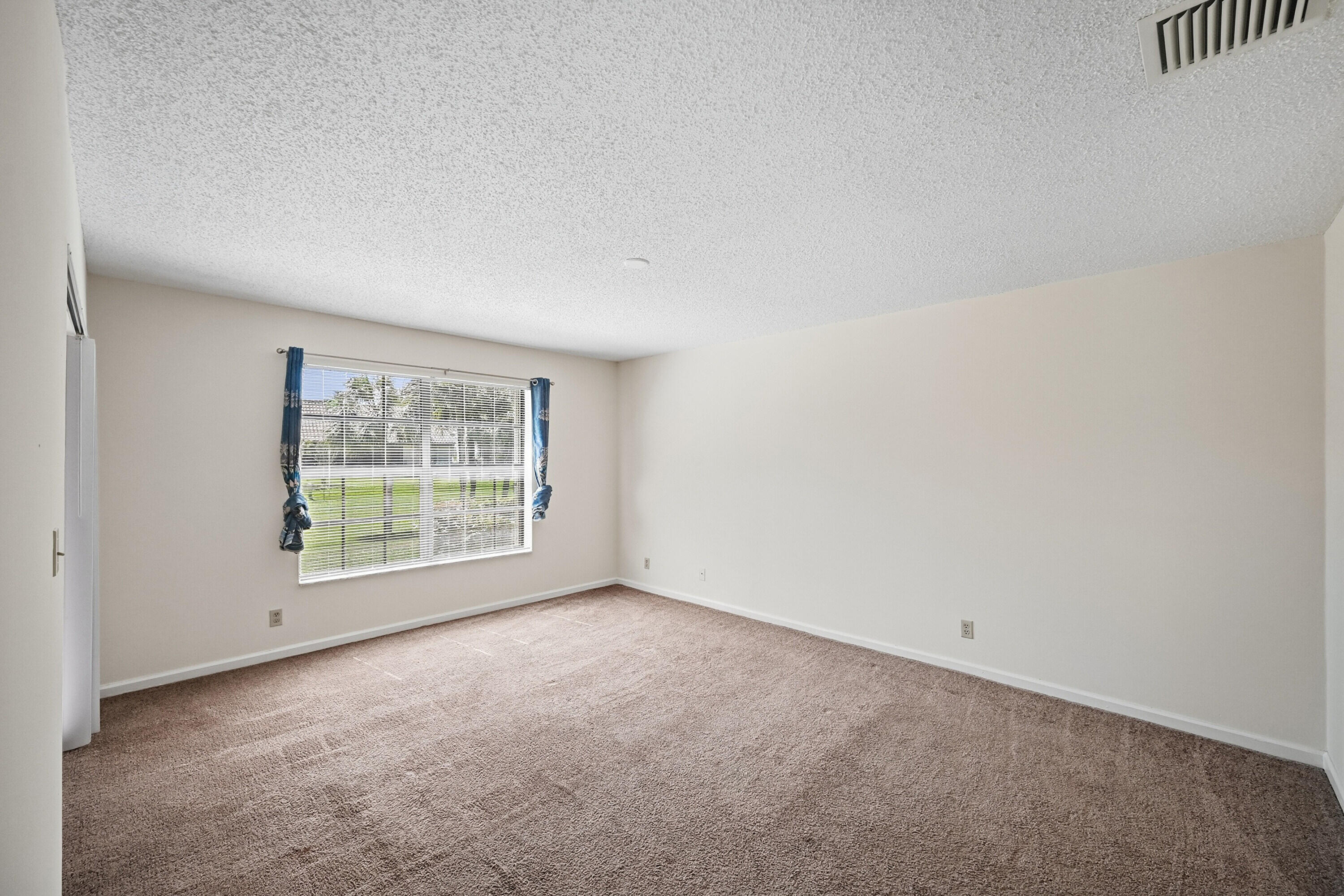 440 Ashwood Place Boca Raton, FL 33431 - Photo 18 of 32 an empty room with a window