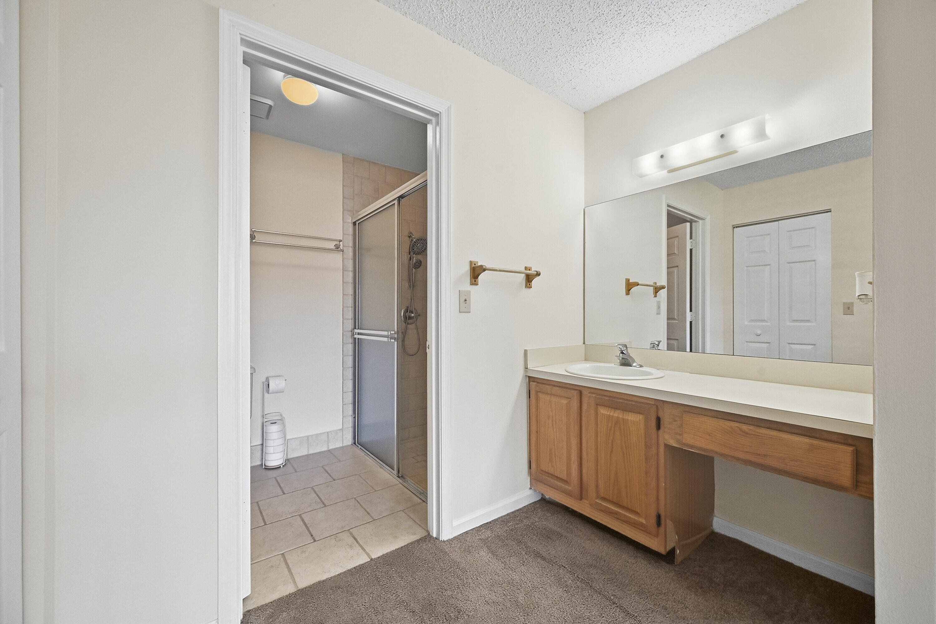 440 Ashwood Place Boca Raton, FL 33431 - Photo 21 of 32 a bathroom with a sink and a mirror