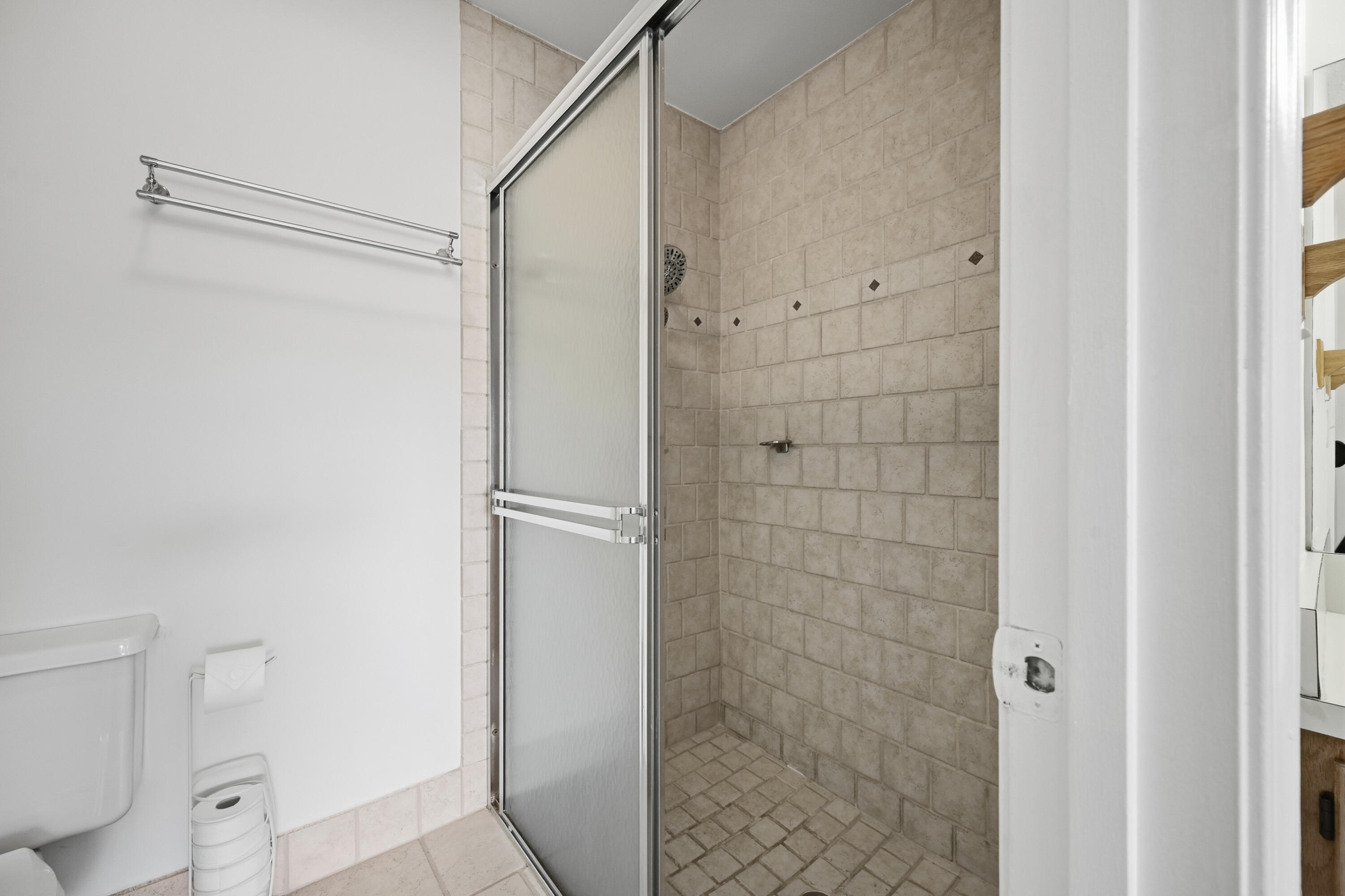 440 Ashwood Place Boca Raton, FL 33431 - Photo 22 of 32 a bathroom with a glass shower door