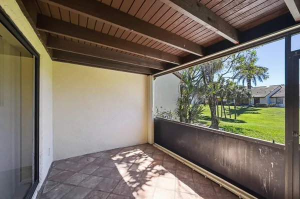 a view of a house with backyard and porch