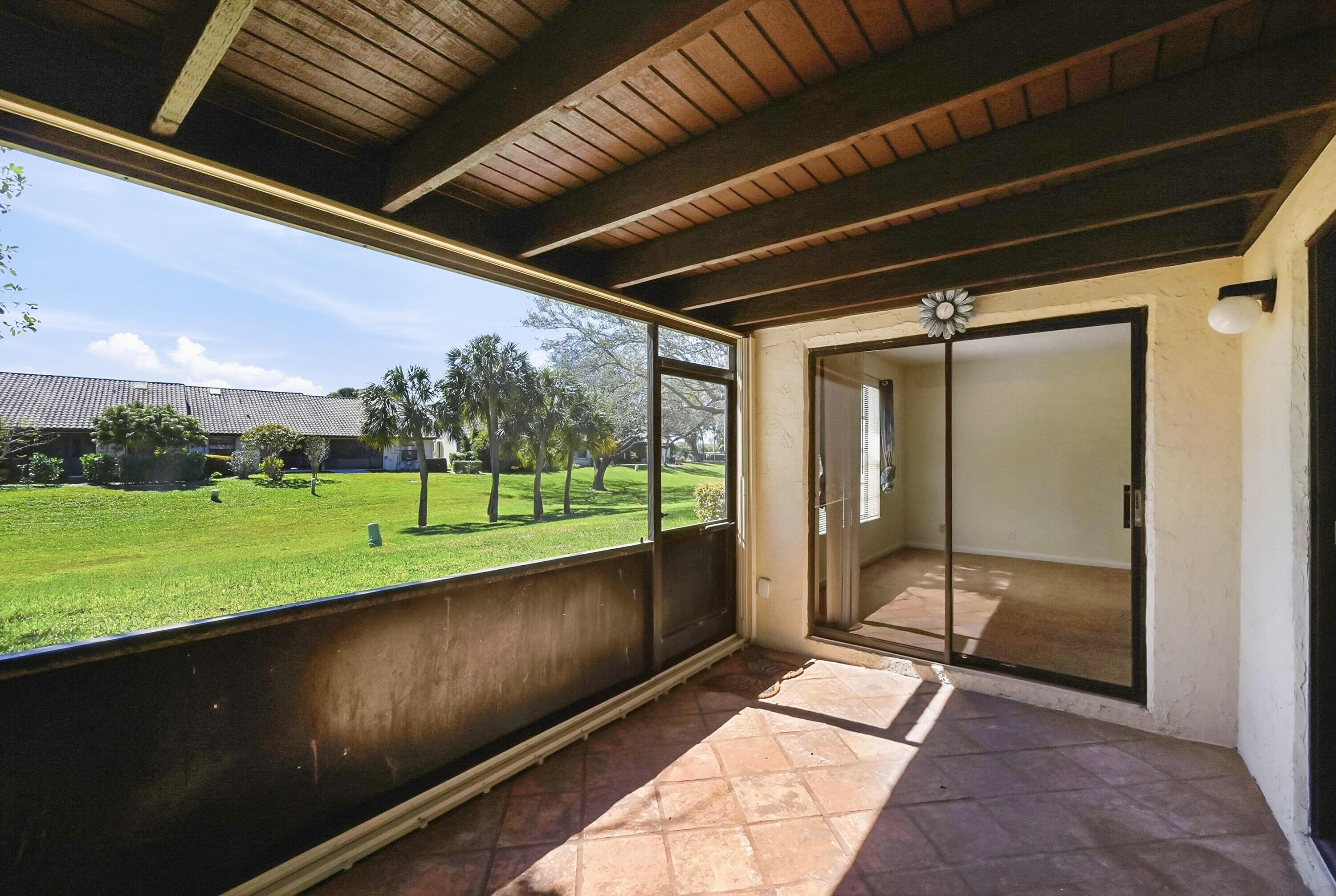 440 Ashwood Place Boca Raton, FL 33431 - Photo 25 of 32 a view of a porch with a yard
